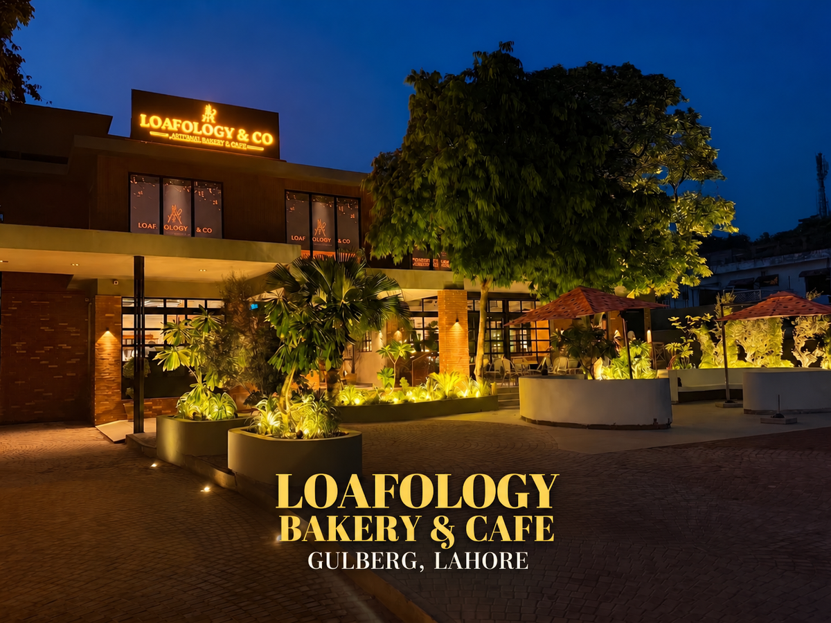 Loafology Gulberg Lahore exterior at dusk with Loafology Bakery & Cafe lettering
